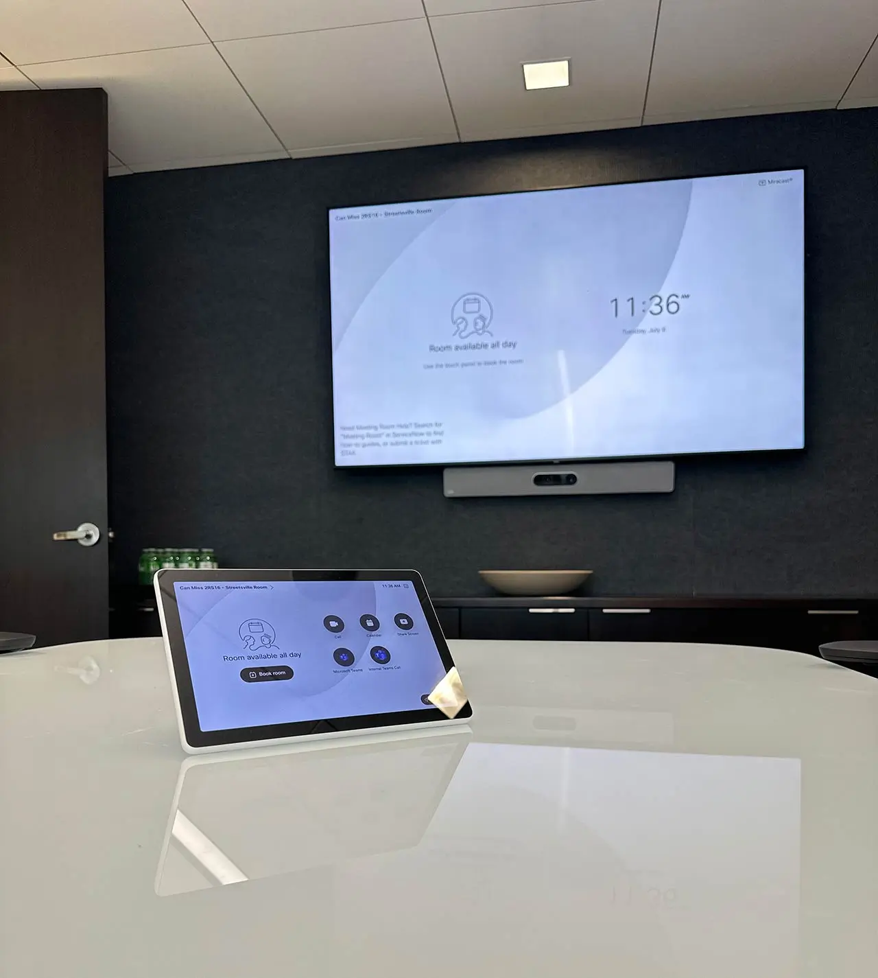 Cisco Room Kit Pro boardroom AV system with touchscreen controller and video display