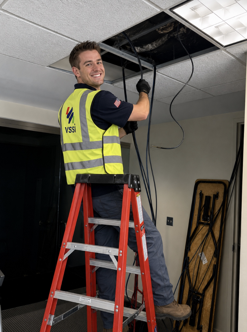VSSi technician drilling cable pass-throughs