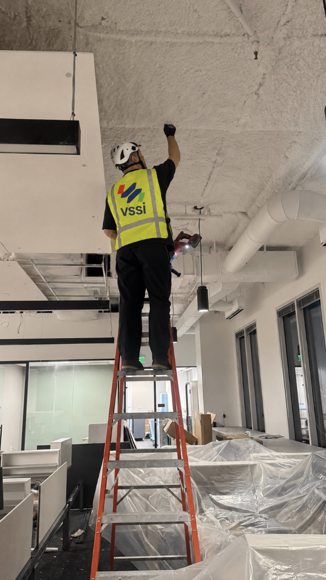 VSSi technician installing overhead cabling