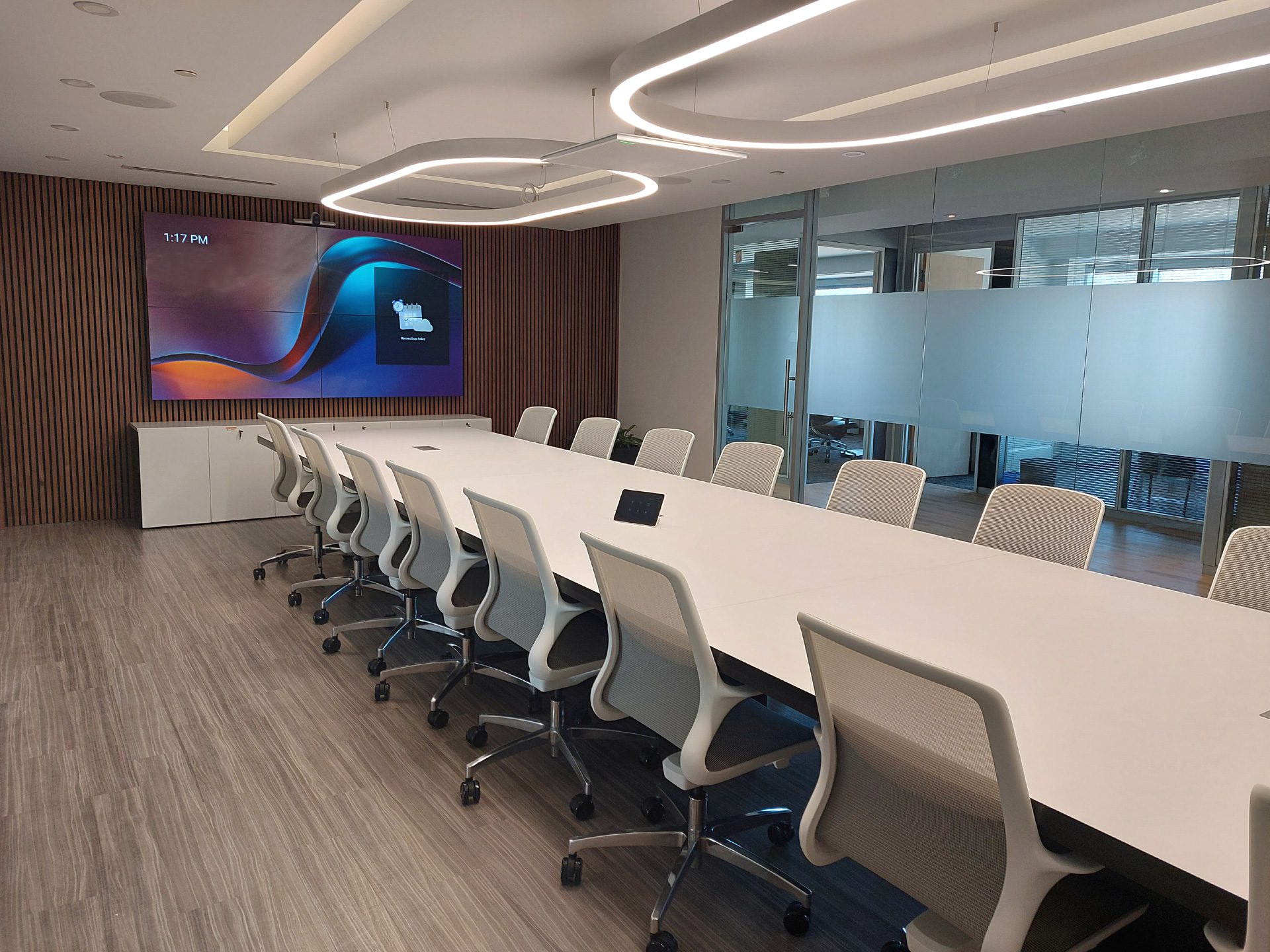 Boardroom equipped with Microsoft Teams Rooms video conferencing display