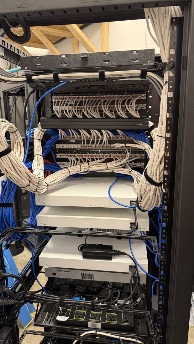 After: close-up of patch panels with dressed and secured cabling
