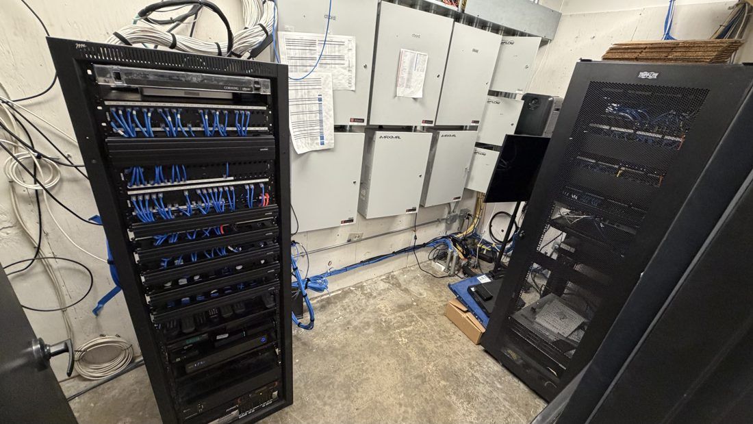 Condo complex equipment room in Arlington, VA after VSSi's rack room cleanup, with new full-size equipment racks